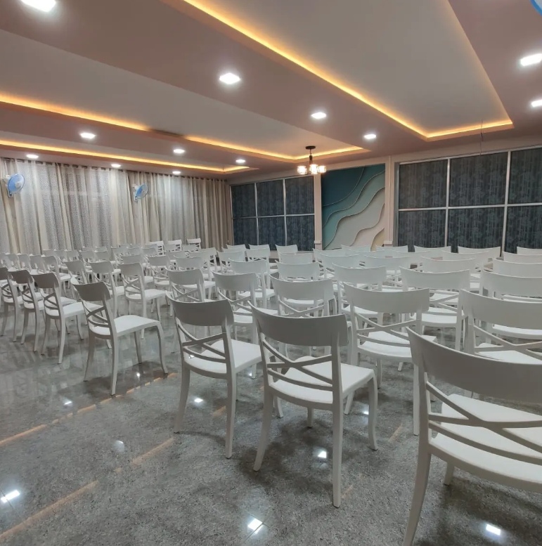 Elegant banquet hall with white chairs